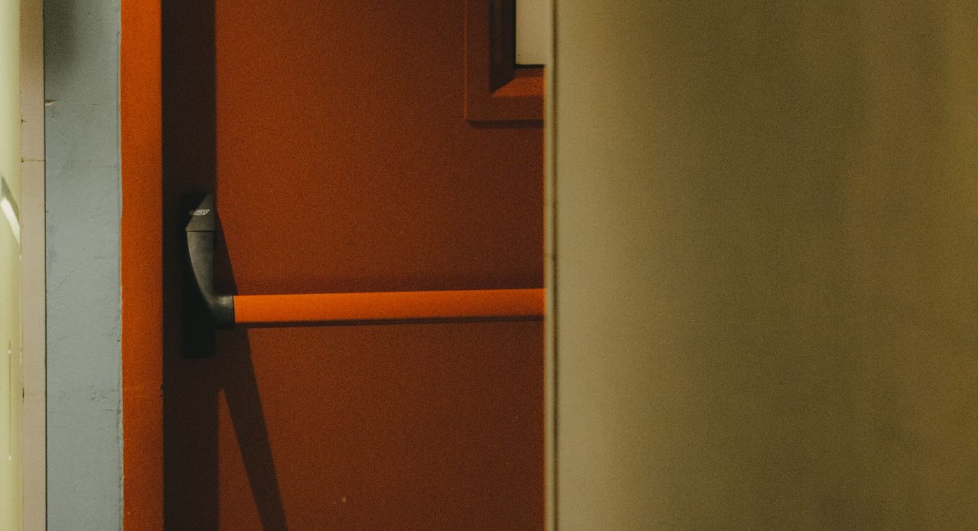 A panic bar exit device on a commercial door